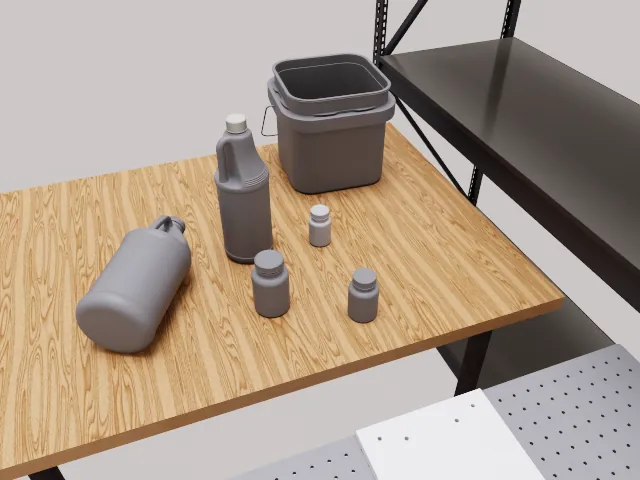 RoboLab scene: a wire shelf with bottles and a bin for shelf manipulation tasks.