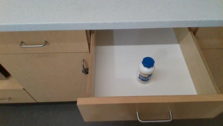 Ego keyframe: an opened drawer containing a white pill bottle with a blue cap