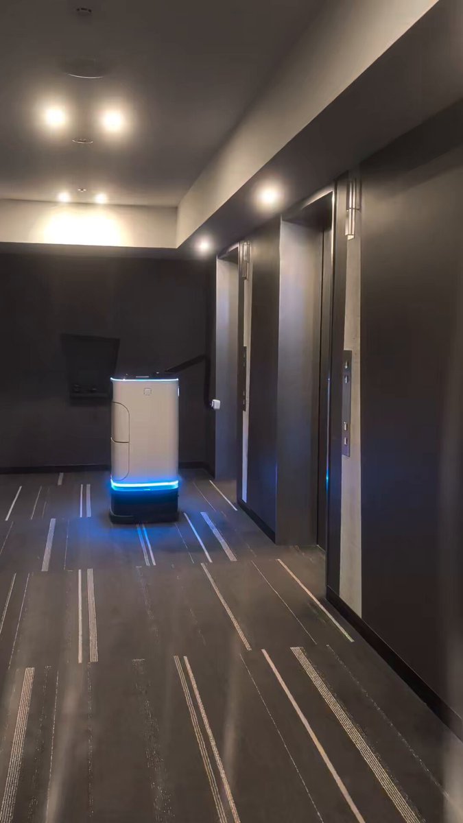 Hotel Delivery Robot Rides the Elevator by Pressing Buttons Itself