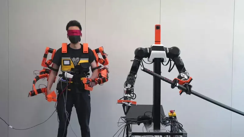UME: A Low-Cost Exoskeleton with Real-Time Haptic Torque Feedback for Mobile Manipulation