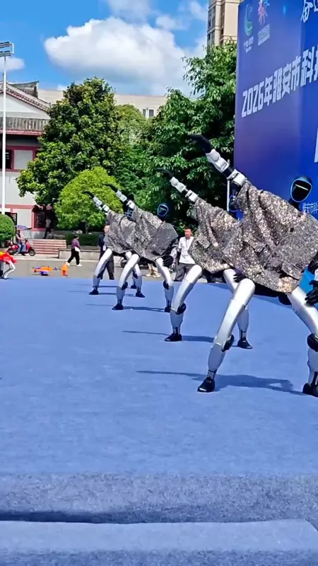 Five Unitree humanoids perform as an outdoor synchronized swarm
